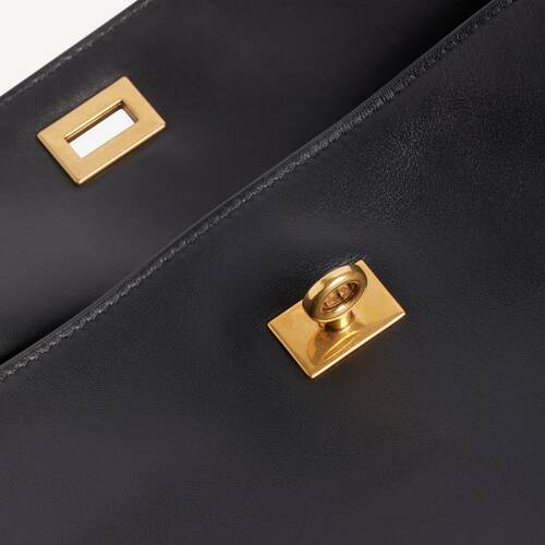bolso con cadena rodeo east-west 
